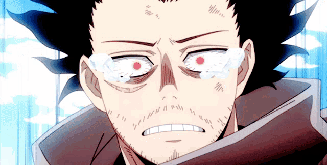 a close up of a man 's face with red eyes
