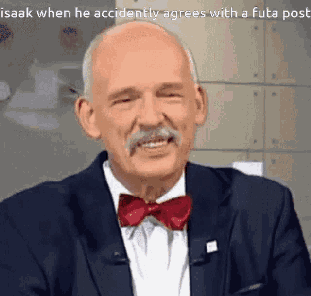 a man with a mustache wearing a bow tie and a suit says isaak when he accidently agrees