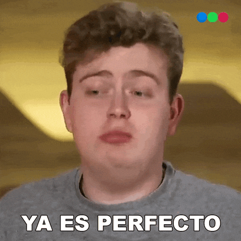 a young man is making a funny face and says ya es perfecto