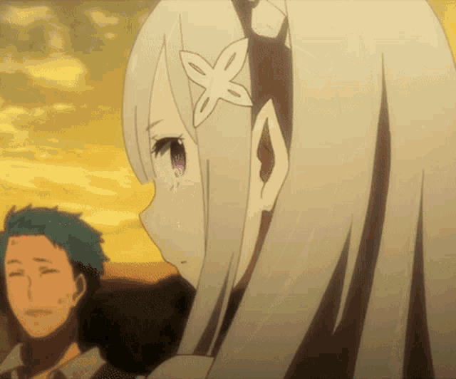 a girl with a flower in her hair is looking at a man