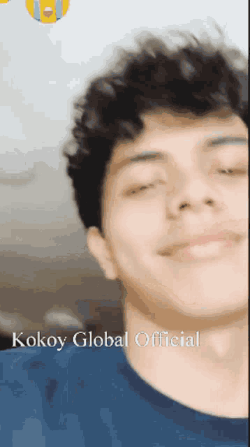 a close up of a man 's face with the words kokoy global official written above him