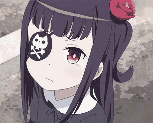 a girl with a patch on her eye that has a cat on it