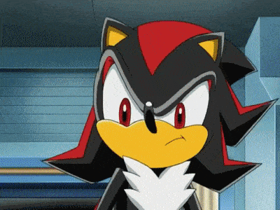 shadow the hedgehog from the video game sonic the hedgehog is looking at the camera with a serious look on his face .