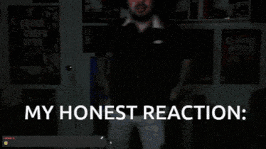 a man stands in front of a wall with posters on it and the words my honest reaction