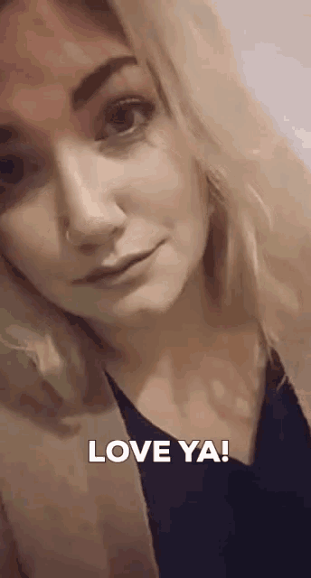 a close up of a woman 's face and the words love ya