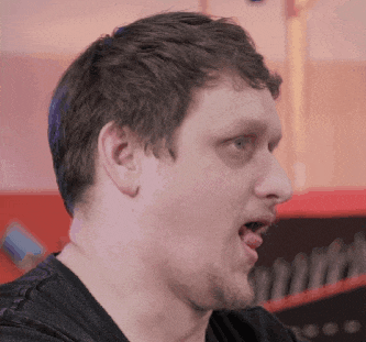 a close up of a man making a funny face