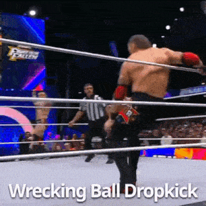 a man in a wrestling ring with the words wrecking ball dropkick above him