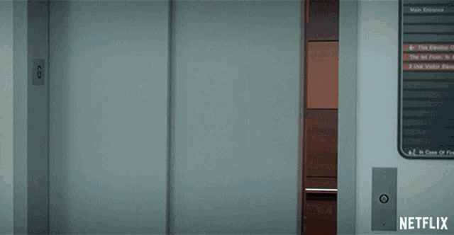 an elevator with a netflix logo on the bottom