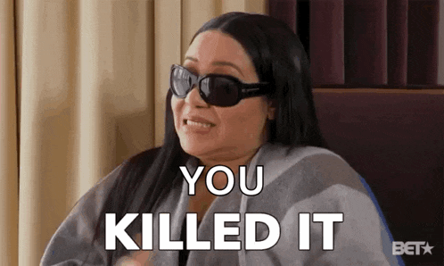 a woman wearing sunglasses is sitting in a chair and saying you killed it .