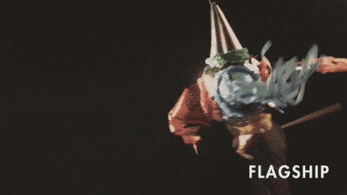 a man is holding a baseball bat and the word flagship is above him