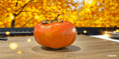 a persimmon sits on a wooden table with a runway logo in the background
