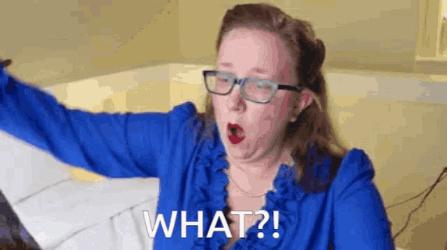 a woman wearing glasses and a blue shirt says what ?
