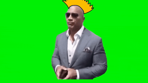 a man in a suit has a yellow mohawk on his head and says it 's the biggest piece of dogshit .