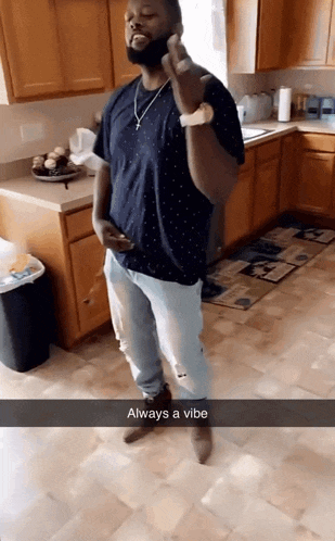a man standing in a kitchen with the words always a vibe on the bottom