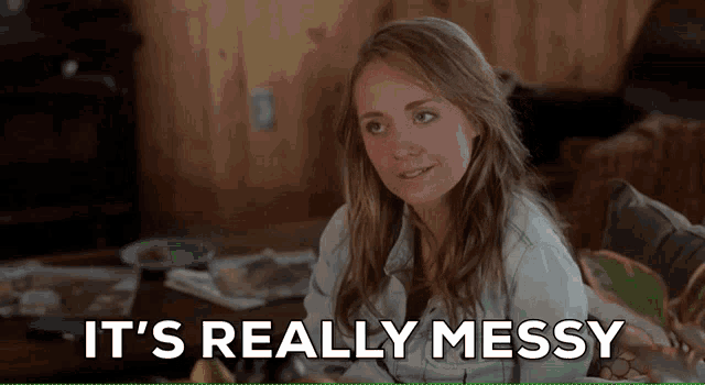 a woman sitting on a couch with the words " it 's really messy " behind her