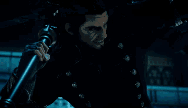 a man with a sword stands in front of a monster