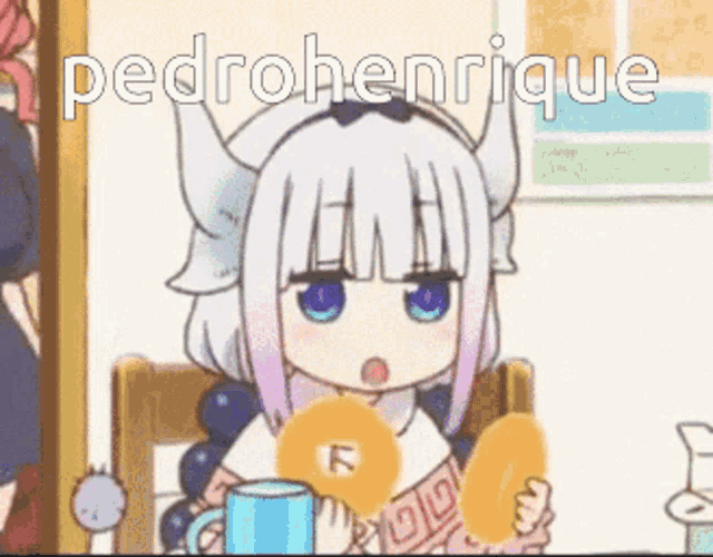 a girl with horns is sitting at a table holding a donut and a cup of coffee .