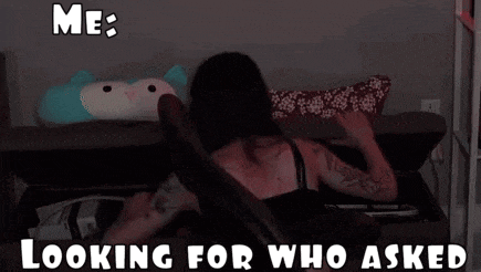 a woman is laying on a couch looking for who asked