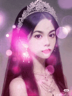 a woman wearing a tiara and a necklace has a pink background with bubbles behind her
