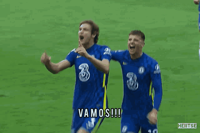 two soccer players are celebrating a goal and one of them is saying vamos !!!