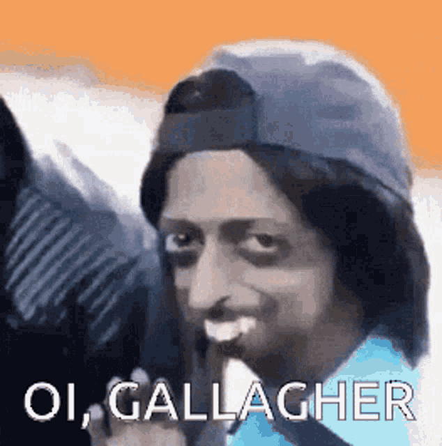 a man wearing a baseball cap and wig is making a funny face and says oi gallagher .