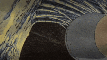 a cartoon drawing of a brick wall with a circle in the middle
