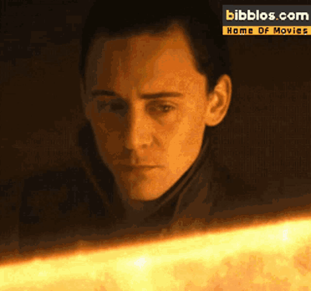 a close up of a man 's face with bibblos.com home of movies in the corner