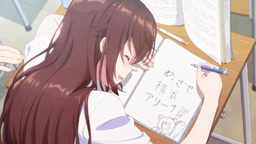 a girl is writing in a notebook with chinese characters on it
