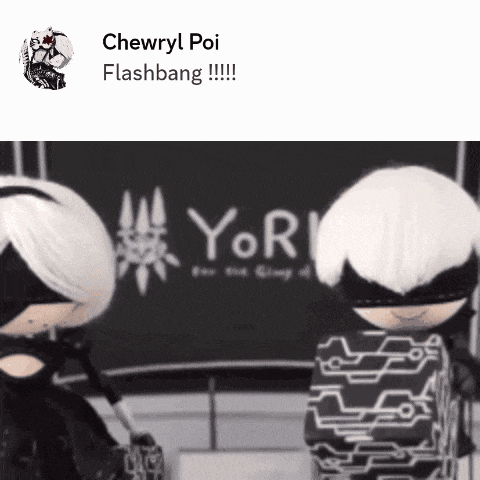 two dolls are standing in front of a sign that says yor