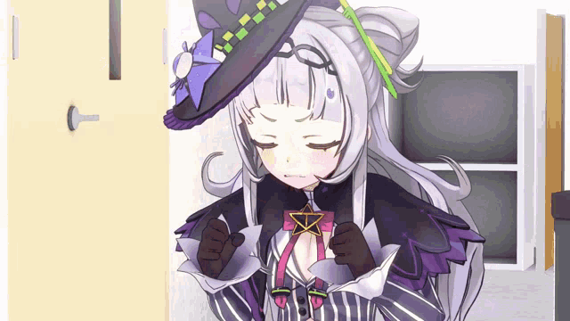 a girl in a witch costume holds a star in her hands