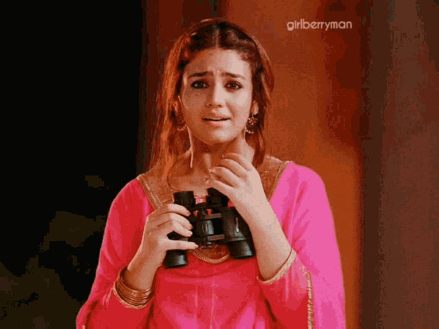 a woman in a pink dress is holding binoculars and the words girlberryman are above her
