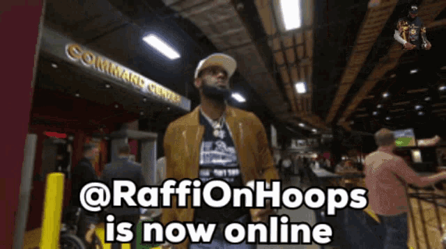 a man standing in front of a sign that says ' @raffinhoops is now online '