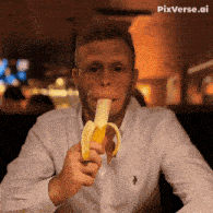 a man in a white shirt is eating a banana with pixverse.ai written in the corner