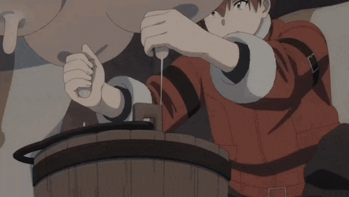 a man in a red shirt is working on a barrel
