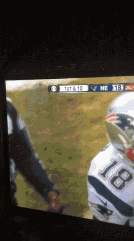 a football game is being played between the patriots and the ravens