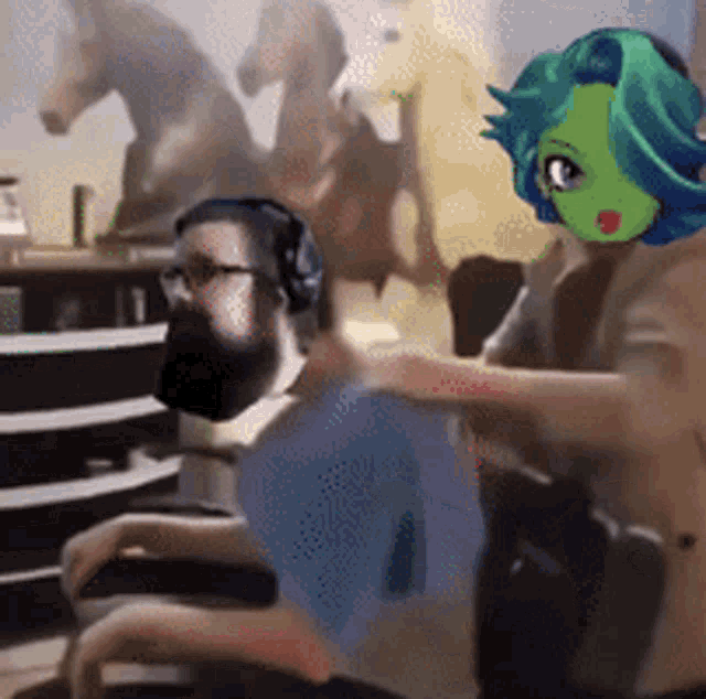a man with a beard and headphones is being massaged by a woman with a green face