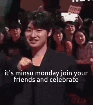 a man is standing in front of a crowd with a sign that says it 's minus monday join your friends and celebrate