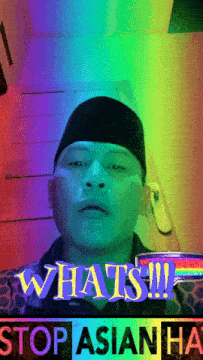 a man with a rainbow background and the words whats stop asian hate behind him