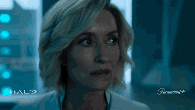 a woman with her eyes closed says okay in front of a halo logo