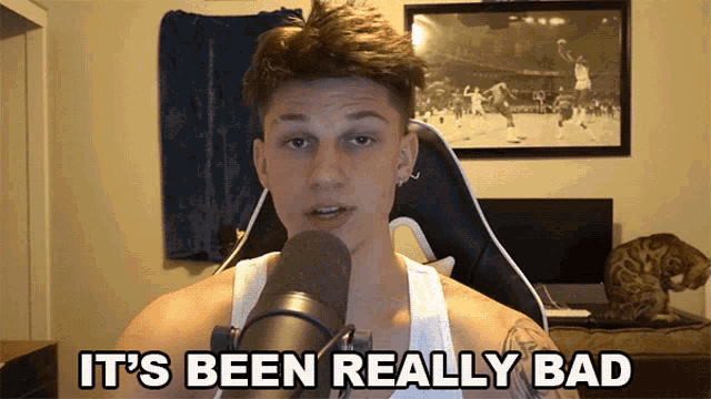 a man talking into a microphone with the words " it 's been really bad " written below him