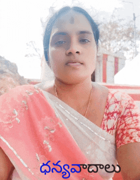 a woman in a pink and white saree with a foreign language on the bottom