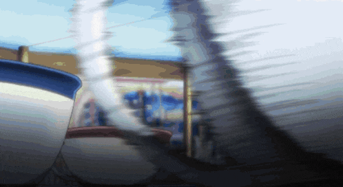 a blurry picture of a person standing in front of a fence
