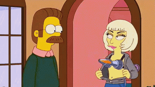 a man and a woman are standing next to each other in a room .