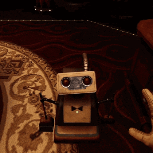 a person 's hand is pressing a button on a machine with a green light on it