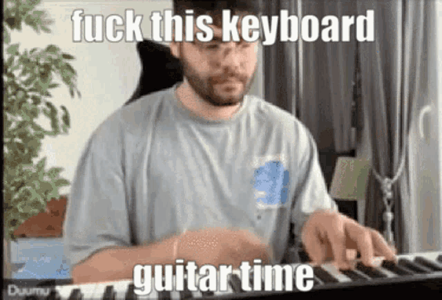 a man with a beard is playing a keyboard with the words `` fuck this keyboard guitar time '' written on it .