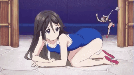 a girl in a blue swimsuit is kneeling on the floor