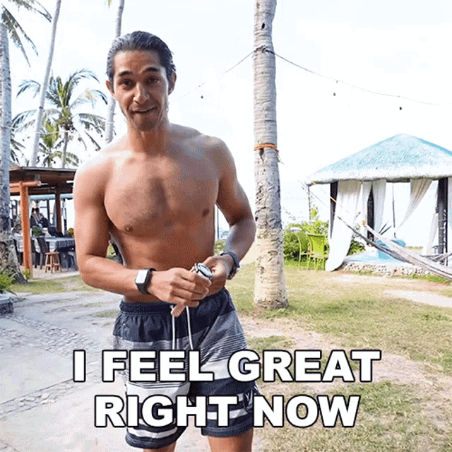 a shirtless man says i feel great right now in front of a hammock