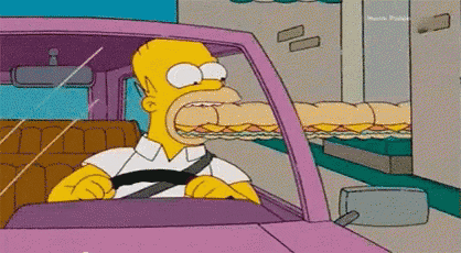 homer simpson is driving a car and eating a sandwich .