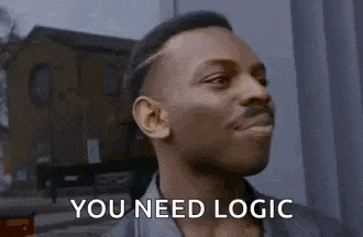 a man is standing in front of a building with the words `` you need logic '' on his face .