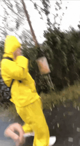 a blurry picture of a person in a yellow jacket